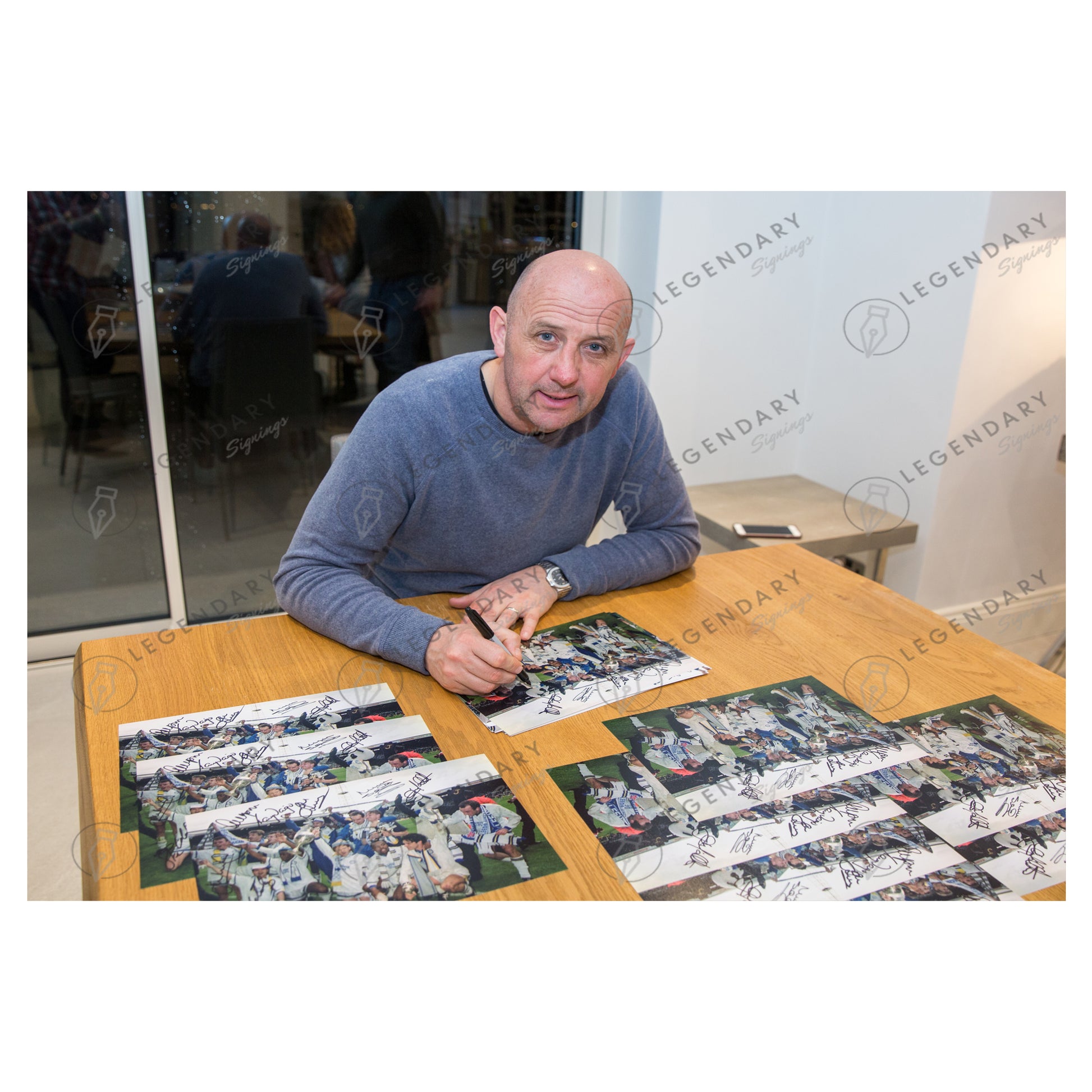 This is a stunning 12x8 framed photograph signed by Leeds United's 1992 championship winning squad.