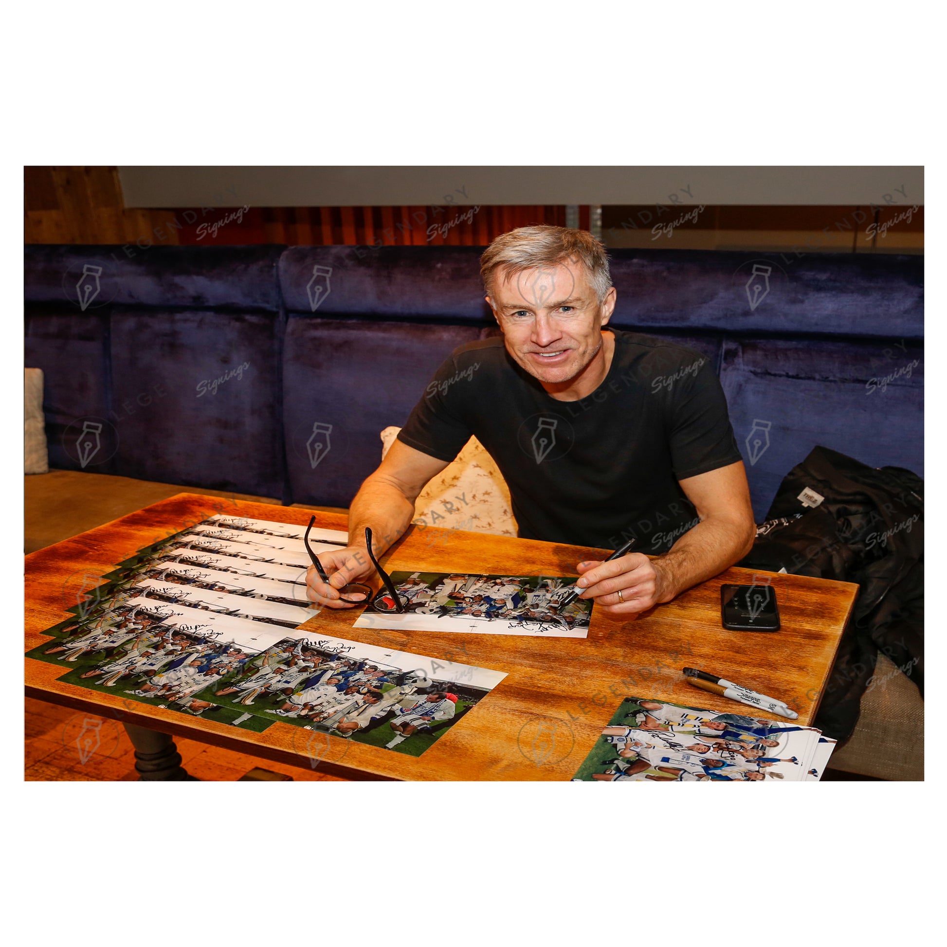 This is a stunning 12x8 framed photograph signed by Leeds United's 1992 championship winning squad.