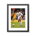 This is a stunning photograph signed by Leeds United legend Lucas Radebe.