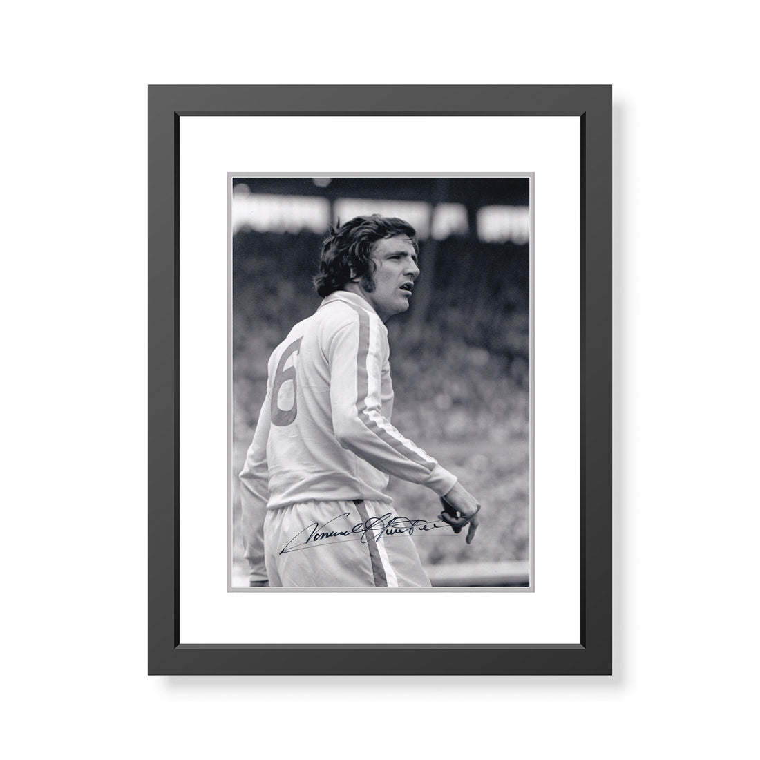 This is a stunning 12x8 framed photograph signed by Leeds United legend Norman Hunter.